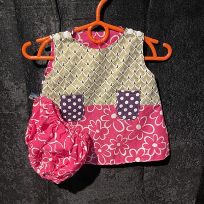 Robe réversible fleurs rose, pois violet 3 mois