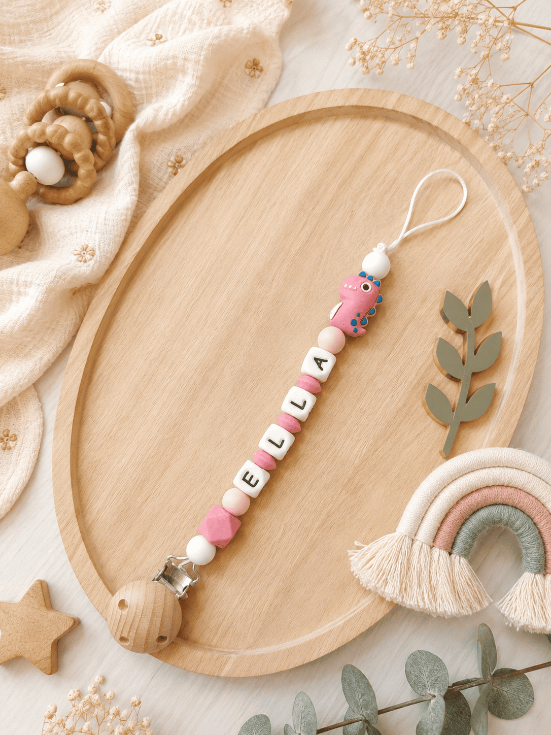 attache tétine dinosaure rose